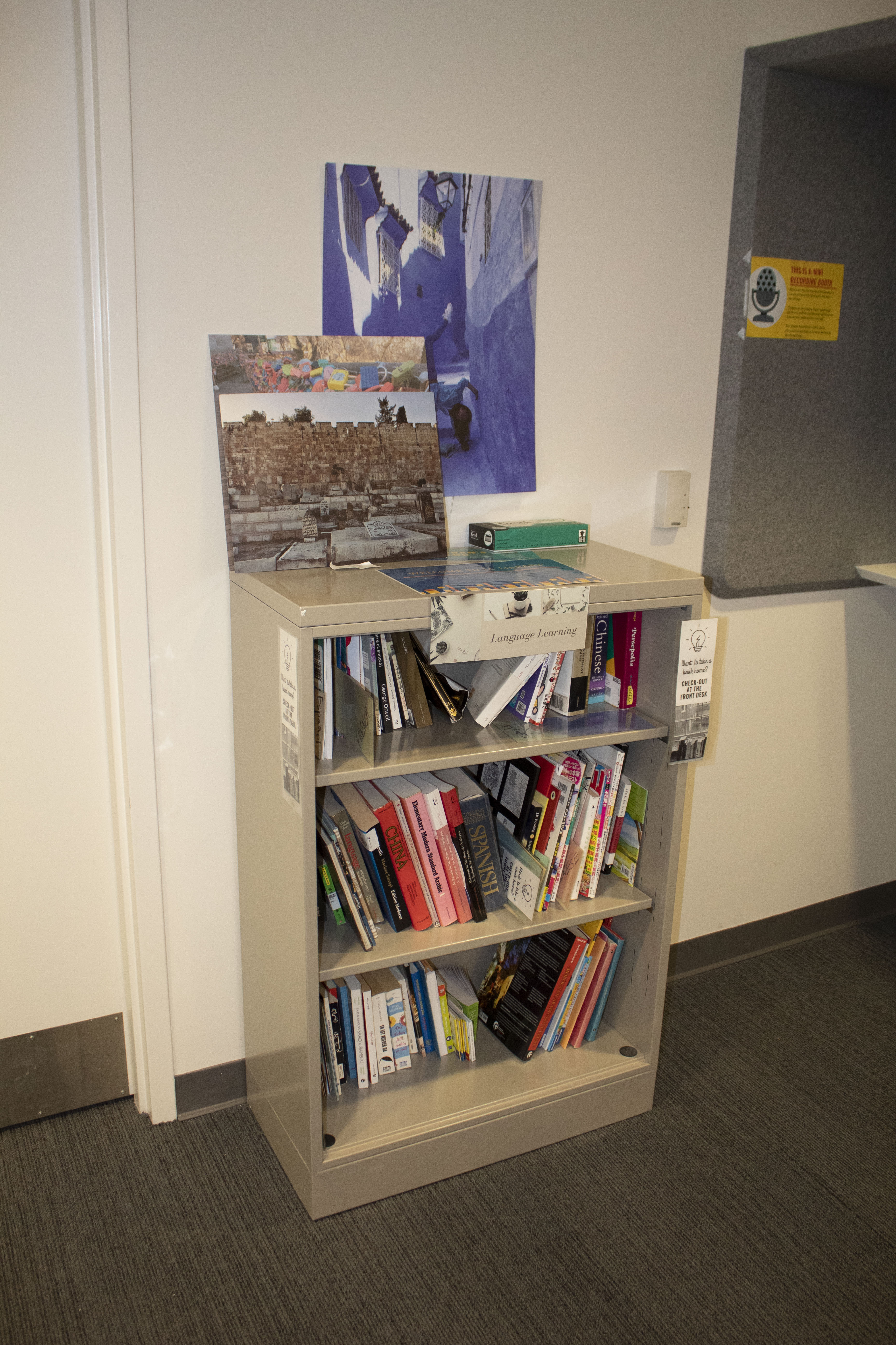small bookshelf with books in multiple languages